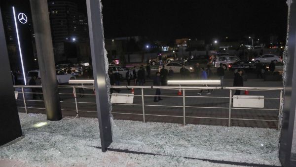 Shattered glass is pictured on the floor of a shop following a rocket attack in Arbil, the capital of the northern Iraqi Kurdish autonomous region, on February 15, 2021. A volley of rockets targeted the Kurdish regional capital in northern Iraq late today, authorities said, as security sources confirmed that at least one hit a military complex hosting US-led coalition troops. SAFIN HAMED / AFP