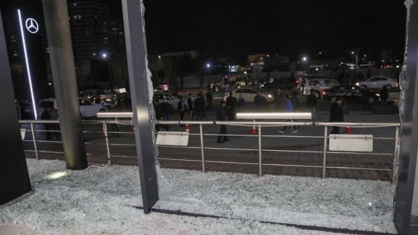 Shattered glass is pictured on the floor of a shop following a rocket attack in Arbil, the capital of the northern Iraqi Kurdish autonomous region, on February 15, 2021. A volley of rockets targeted the Kurdish regional capital in northern Iraq late today, authorities said, as security sources confirmed that at least one hit a military complex hosting US-led coalition troops. SAFIN HAMED / AFP