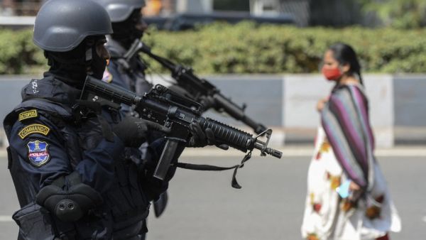 Organisation for Counter Terrorist Operations (OCTOPUS) special police unit commandos stand guard during a security drill in Hyderabad on February 24, 2021. NOAH SEELAM / AFP