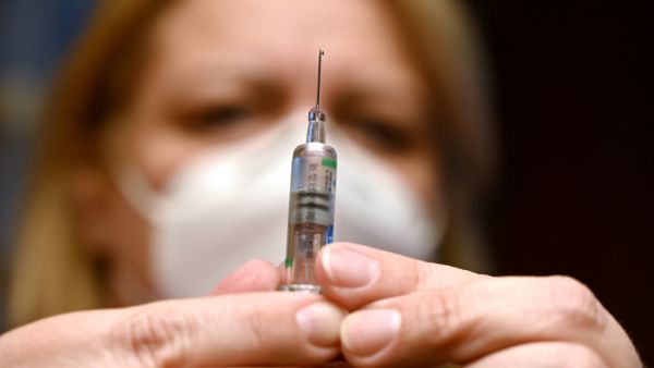 A nurse prepares a dose of the Covid-19 vaccine developed by China's Sinopharm company, at a vaccination center of a seniors club in Budapest on February 25, 2021, amid the ongoing coronavirus Covid-19 pandemic. Hungary on February 24, 2021 became the first EU nation to start using China's coronavirus Sinopharm vaccine, Prime Minister Viktor Orban said. The country of 10 million has ordered around five million doses of the Chinese jab, and has already started inoculating its population with Russia's Sputnik