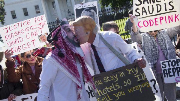  In this file photo taken on October 19, 2018, demonstrators dressed as Saudi Arabian Crown Prince Mohammed bin Salman and US President Donald Trump (C) pretend to kiss outside the White House in Washington, DC, demanding justice for missing Saudi journalist Jamal Khashoggi. The US director of national intelligence is expected to release a damning report on February 26, 2021, that fingers Saudi Crown Prince Mohammed bin Salman for the brutal murder and dismemberment of dissident journalist Jamal Khashoggi i