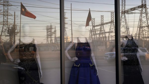 An electrical substation is reflected in the window of a dress shop on February 21, 2021 in Houston, Texas. Millions of Texans lost their power when winter storm Uri hit the state and knocked out coal, natural gas and nuclear plants that were unprepared for the freezing temperatures brought on by the storm. Wind turbines that provide an estimated 24 percent of energy to the state became inoperable when they froze. Justin Sullivan/Getty Images/AFP JUSTIN SULLIVAN / GETTY IMAGES NORTH AMERICA / Getty Images v