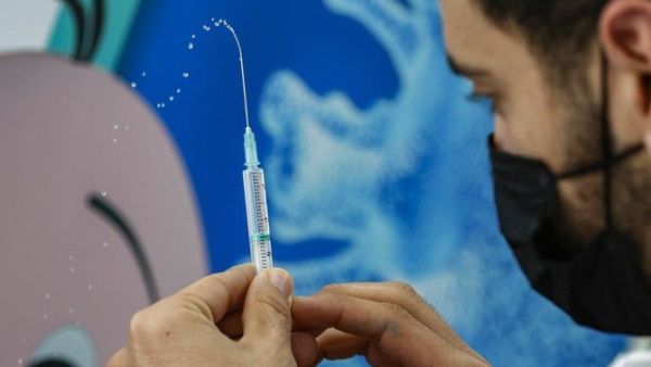 A health worker prepares a dose of the Pfizer-BioNtech COVID-19 coronavirus vaccine at Clalit Health Services, in Israel’s Mediterranean coastal city of Tel Aviv on Jan. 23, 2021. (File/AFP)