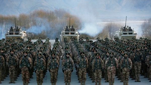 This photo taken on January 4, 2021 shows Chinese People's Liberation Army (PLA) soldiers assembling during military training in Xinjiang. (AFP)