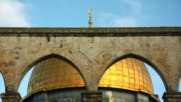 gold dome and arches Israel, Jerusalem: a mosque Dome of the Rock and a light vaulted arch. golden dome, blue sky. on the arch a sundial  (Shutterstock)	
