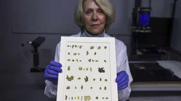  Tanya Bitler displays the recently-discovered 2000-year-old biblical scroll fragments