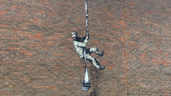 Banksy on a prison wall (Twitter)