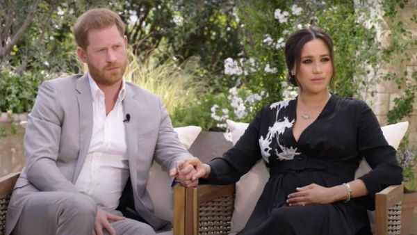 Prince Harry and proud mom Meghan 