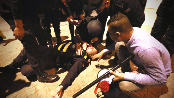 Jordanian security officer assisted during a protest in Amman