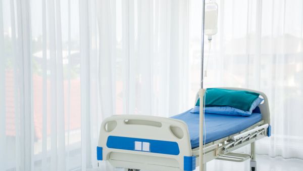 An empty hospital bed 