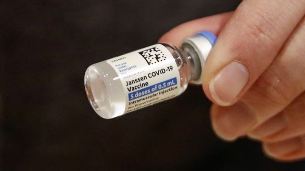 Nurse Florisa N. Lingad holds a Johnson & Johnson Janssen Covid-19 vaccine at a vaccination center established at the Hilton Chicago O'Hare Airport Hotel in Chicago, Illinois.
