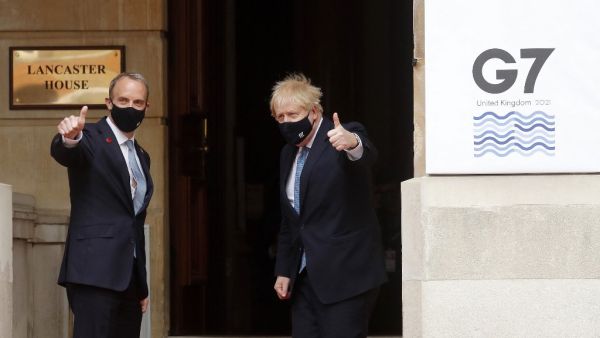 Britain's Foreign Secretary Dominic Raab (L) and Prime Minister Boris Johnson arrive at the G7 foreign ministers meeting in London on May 5, 2021. G7 foreign ministers meet in London for their first face-to-face talks in more than two years, with calls for urgent joined-up action to tackle the most pressing global threats. Frank Augstein / POOL / AFP Foreign ministers calls on North Korea to return to peace talks