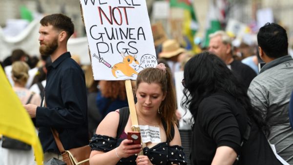 Protesters gathered in Parliament Square on Saturday to protest against the UK vaccination rollout