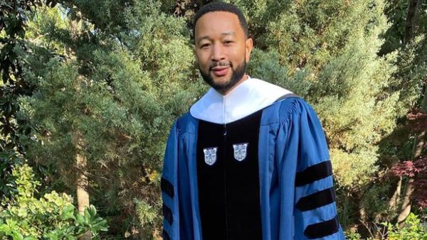 John  was handed an honorary degree 