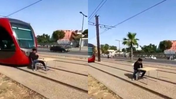 مستهتر يقطع طريق القطار لشرب القهوة 