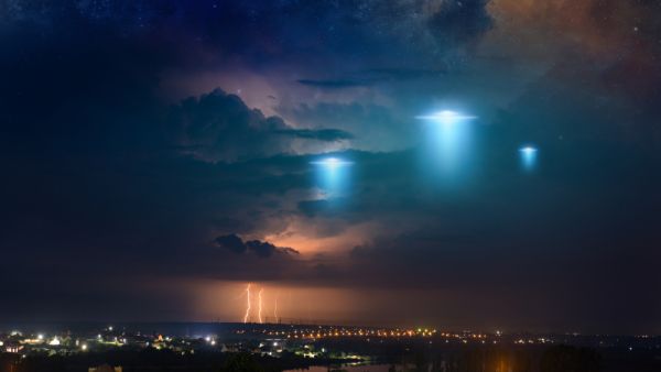 extraterrestrial aliens spaceship fly above small town