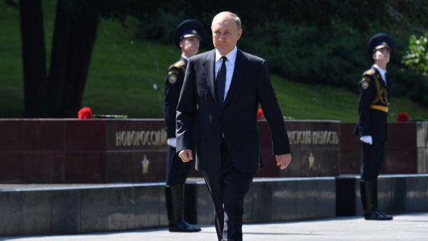 Russian President Vladimir Putin walks to attend the flower-laying ceremony at the Tomb of the Unknown Soldier to mark the 80th anniversary of the German invasion of the Soviet Union in WWII, in Alexander Garden in Moscow 