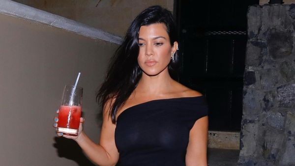 Kourtney Kardashian Is Seen in a Sheer Top Over a Nude Bra