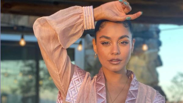 Vanessa Hudgens proudly shows off her 10th tattoo... a boa constrictor along inside of her left ankle