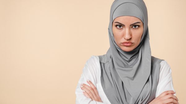 Offended sad angry with negative emotions young middle eastern arabian muslim islamic woman