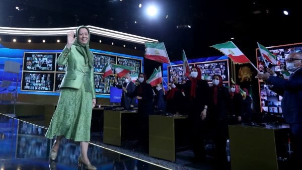 Leader of the People's Mujahedin of Iran Maryam Rajavi waves during "Free Iran World Summit 2021" at Ashraf-3 camp, which is a base for the People's Mojahedin Organization of Iran (MEK) in the Albanian town of Manza, on July 10, 2021. Gent SHKULLAKU / AFP the online event is organized by Iranian opposition group the National Council of Resistance of Iran
