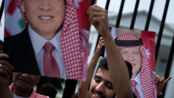 Supporters of Jordan's King Abdullah II are seen on Pennsylvania Avenue outside the White House before the leader's visit with US President Joe Biden on July 19, 2021, in Washington, DC. Brendan Smialowski / AFP King Abdullah and US President Biden held a summit meeting