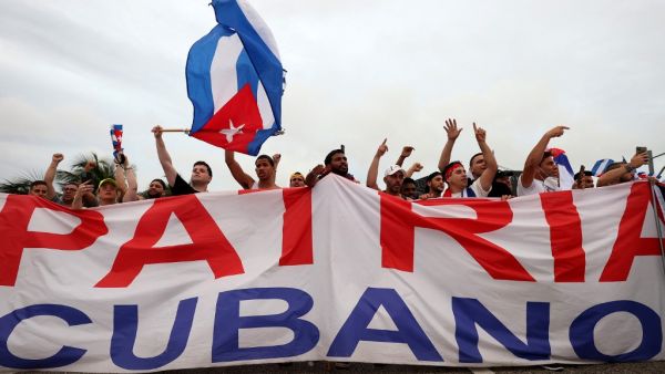 Protesters shut down part of the Palmetto Expressway as they show their support for the people in Cuba that have taken to the streets to protest on July 13, 2021 in Miami, Florida. JOE RAEDLE / GETTY IMAGES NORTH AMERICA / Getty Images via AFP One man dead, hundreds arrested amid protests against economic crisis