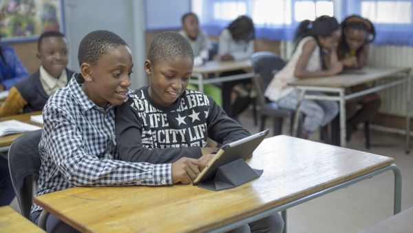 Children in school. New Report: Connecting Schools Has The Potential To Boost GDB By Up To 20 Percent In The Least Connected Nations