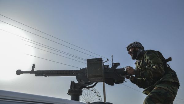 Afghan security personnel and Afghan militia fighting against Taliban, stand guard in Enjil district of Herat province on July 30, 2021. (Photo by Hoshang Hashimi / AFP) Taliban say capital of Afghanistan's Takhar province seized