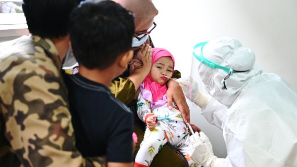 A child is tested for the Covid-19 coronavirus in Banda Aceh on August 13, 2021.