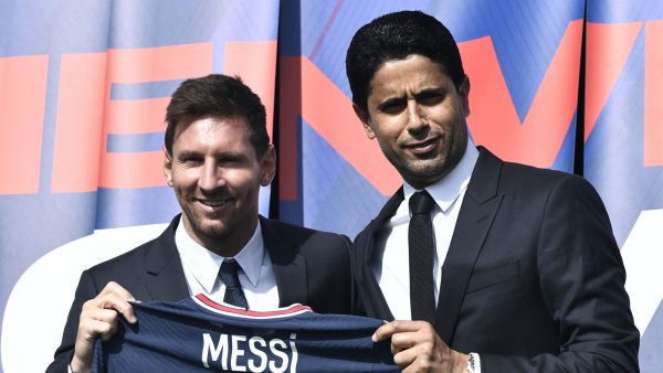 PSG's Qatari President Nasser Al-Khelaifi (R) poses along side Argentinian football player Lionel Messi as he holds-up his number 30 shirt during a press conference at the French football club Paris Saint-Germain's (PSG) Parc des Princes stadium in Paris on August 11, 2021 (Photo: AFP)