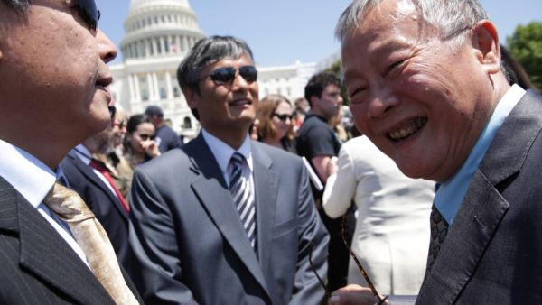 Chinese dissidents Chen Guangcheng (2nd R) and Wei Jingsheng (R) share a moment during a rally to commemorate the 30th anniversary of the Tiananmen Square massacre June 4, 2019 at the West Lawn of the U.S. Capitol in Washington, DC. Alex Wong/Getty Images/AFP Trump administration refused to believe china's warning of Covid-19