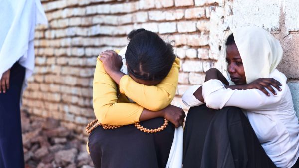 Friends of a Sudanese protester react during her funeral procession in the capital Khartoum on November 20, 2021. (Photo by AFP) Sudan’s military rulers have declined to receive an African Union special envoy