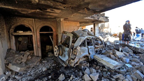 Yemenis inspect the damage following overnight air strikes by the Saudi-led coalition