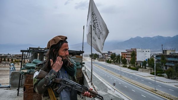 A Taliban fighter mans a post on the roof top of the main gate of Laghman University in Mihtarlam, Laghman province on February 2, 2022. (Photo by Mohd RASFAN / AFP) The Taliban’s Challenges of Starting Inter-Afghan Talks