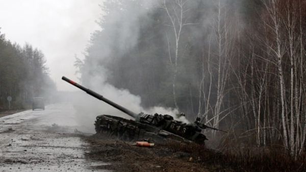 Smoke rises from a Russian tank