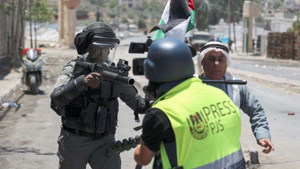 Journalists face the Israeli gun