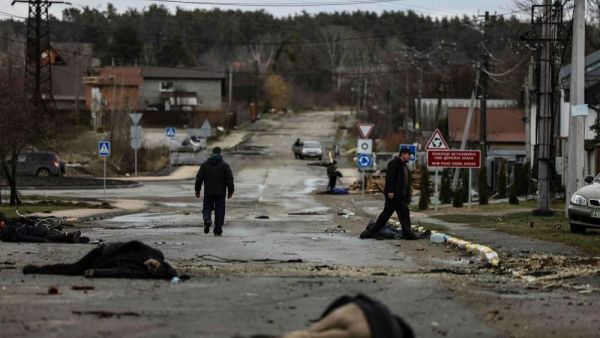 Bodies lie on a street in Bucha
