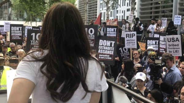Stella Assange speaks to the crowd outside the Home Office