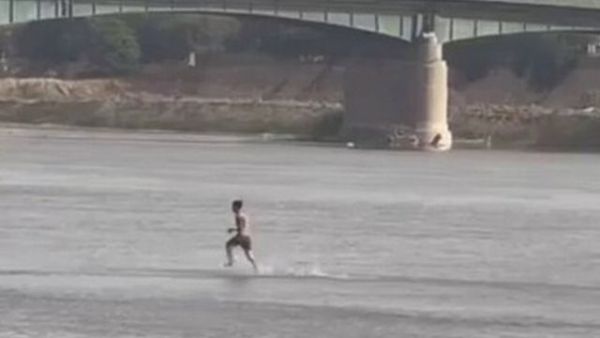 رجل يسير على نهر دجلة ويصدم العراقيين