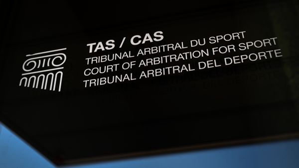 A picture taken on March 21, 2022 shows a sign and logo of the Court of Arbitration for Sport at their new headquarters in in Lausanne, western Switzerland. The Russian football team remains excluded from the qualifying play-offs for the 2022 World Cup at the end of March after the Court of Arbitration for Sport on March 18, 2022 rejected the Russian Federation's request to suspend Fifa's sanctions. (Photo by Fabrice COFFRINI / AFP)