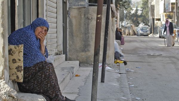 Palestinian refugee Zainab, aged 78, looks on in a street of the Baqa'a Palestinian refugee camp, near Amman, on 2 september 2018. AFP / AHMAD ABDO Baqa'a camp