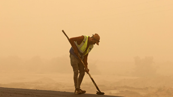 A worker in the sandstorm 