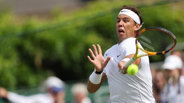 Spain's Rafael Nadal returns to Canada's Felix Auger-Aliassime during their men's exhibition singles match at The Giorgio Armani Tennis Classic tournament at the Hurlingham Club in London on June 24, 2022. (Photo by Adrian DENNIS / AFP)