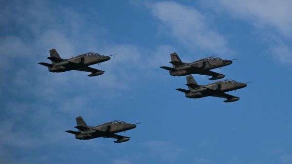A squad of Chinese-made K8 aircrafts that are part of the Venezuelan Air Force overfly a military parade to celebrate Venezuela's 211th anniversary of its Independence in Caracas on July 5, 2022. (Photo by Federico PARRA / AFP) Chinese military