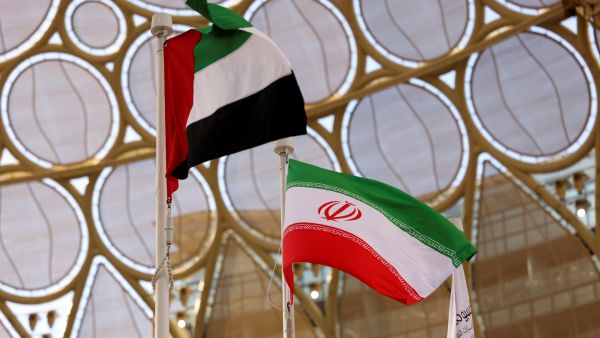 The flags of United Arab Emirates and Iran are pictured during a national event at the Iranian Pavilion of Expo 2020, in the Gulf emirate of Dubai on February 7, 2022. (Photo by Karim SAHIB / AFP) UAE Ambassador