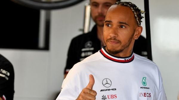 Mercedes' British driver Lewis Hamilton salutes the crowd in the pits during the first free practice session ahead of the French Formula One Grand Prix at Le Castellet circuit, southern France, on July 22, 2022. (Photo by Sylvain THOMAS / AFP)