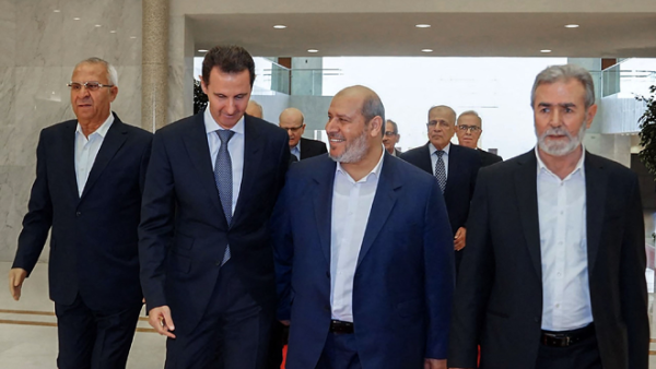 This handout photo released by the Syrian Presidency shows Syria’s President Bashar Assad (second left) receiving the leader of Palestinian group Islamic Jihad, Ziad Al Nakhala (right) Hamas chief of Arab relations, Khalil Al Hayya (second right) and secretary general of the Popular Front for the Liberation of Palestine, Talal Naji (left), in the capital Damascus, on Wednesday (AFP photo) Hamas leaders in Damascus