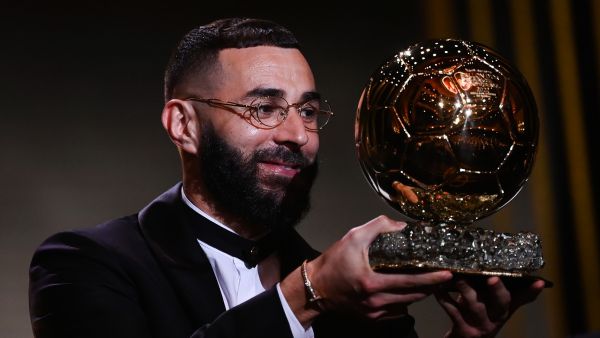 Real Madrid's French forward Karim Benzema receives the Ballon d'Or award during the 2022 Ballon d'Or France Football award ceremony at the Theatre du Chatelet in Paris on October 17, 2022. (Photo by FRANCK FIFE / AFP)