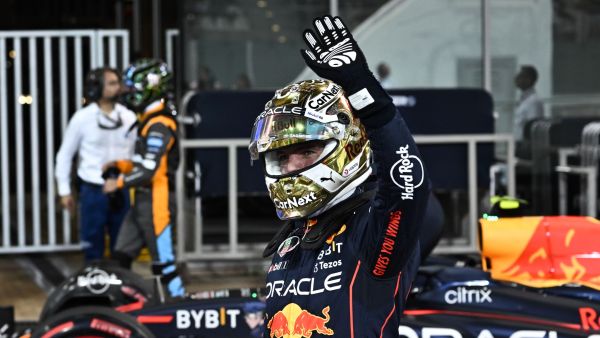 Red Bull's Dutch driver Max Verstappen waves to the crows after the qualifying session on the eve of the Abu Dhabi Formula One Grand Prix at the Yas Marina Circuit in the Emirati city of Abu Dhabi on November 19, 2022. (Photo by Ben Stansall / AFP)